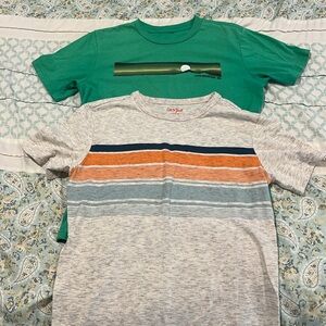 2 t-shirts! Both size large. Off-white with stripes 12-14. Green 10-12.